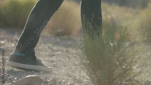 A man kicking literal rocks in the Nevada desert outside of Las Vegas photo