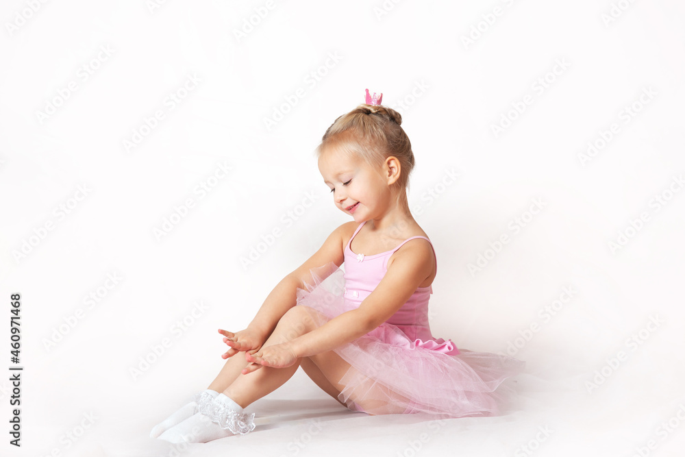 girls - young ballerinas in pink dresses on a light background girls - young ballerinas in pink dresses on a light background