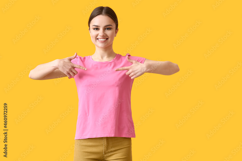 Young woman in modern t-shirt on color background Young woman in modern t-shirt on color background
