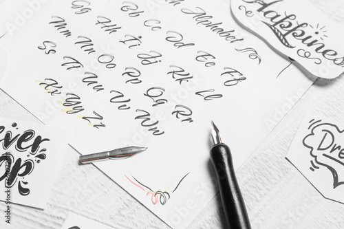 Paper with alphabet and nib...