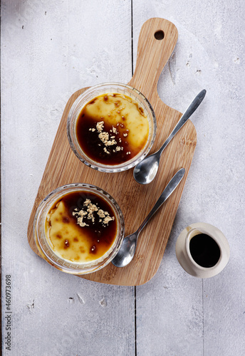 Kurozato panacotta with kuromitsu sauce and sprinkled with roasted kinako powder.   photo