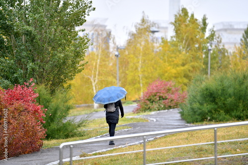 umbrella, rain, woman, people, walking, business, weather, nature, autumn, businessman, walk, road, street, person, sky, outdoor, summer, day, park, water, color, concept, outdoors, protection, rainin photo