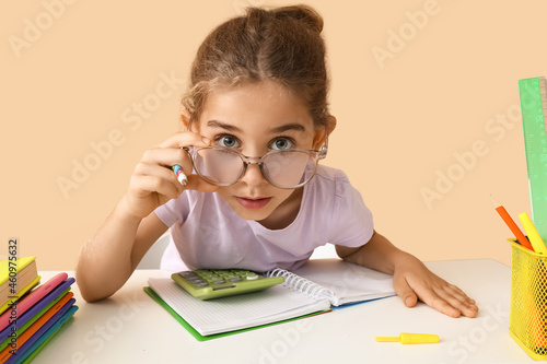 Little girl doing homework ...