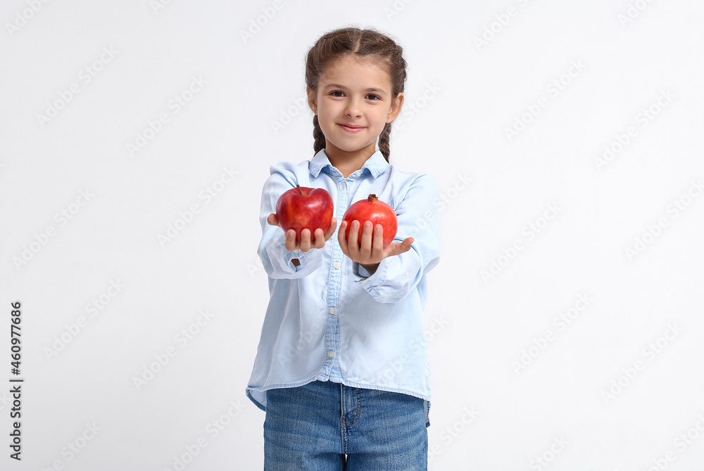 Little girl with fruits on white background Little girl with fruits on white background