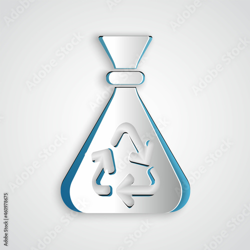 Paper cut Garbage bag with recycle symbol icon isolated on grey background. Trash can icon. Recycle basket sign. Paper art style. Vector