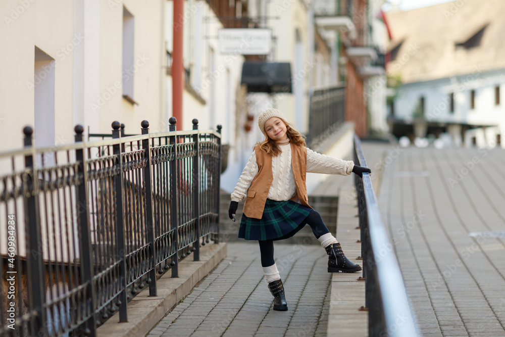 cute girl dressed in autumn clothes on a walk cute girl dressed in autumn clothes on a walk