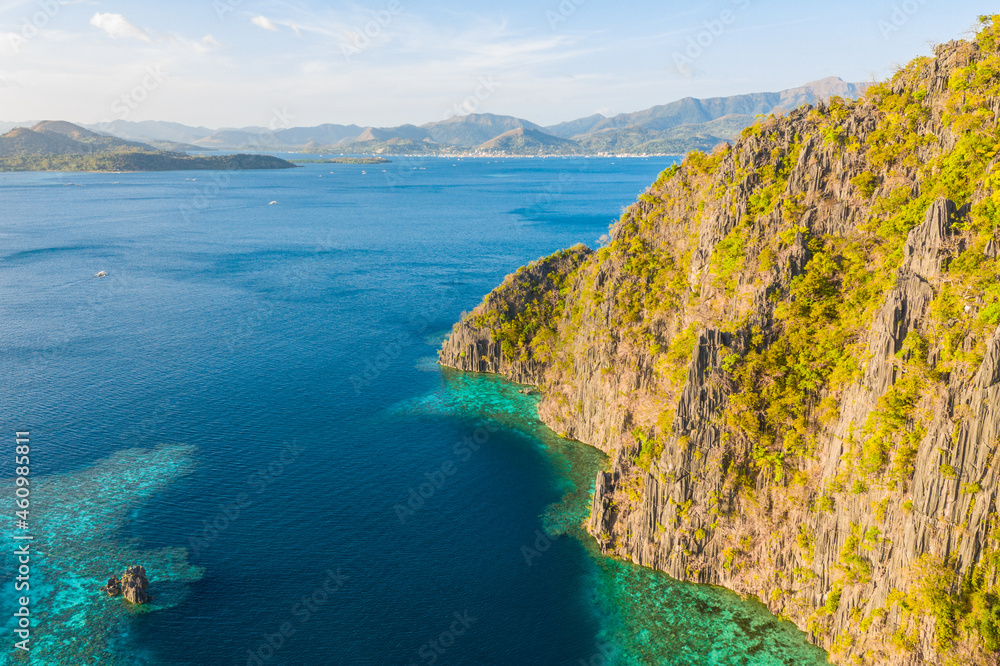 Aerial view of turquoise tropical lagoon with limestone cliffs in Coron Island, Palawan, Philippines. UNESCO World Heritage.