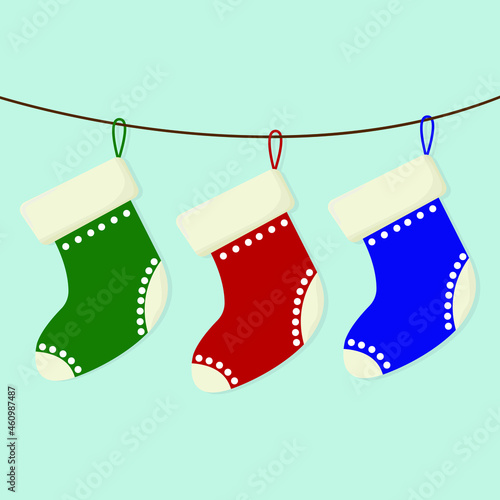 Christmas socks vector. Christmas socks hang on a rope.