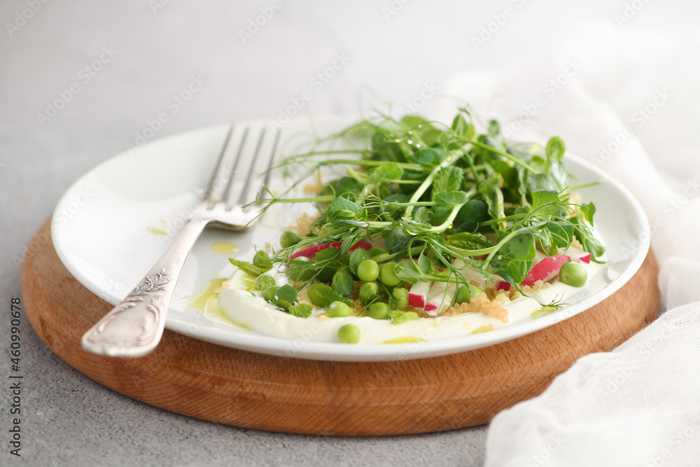 Vegan healthy salad made microgreen sprouts peas, quinoa, radish, mint and yogurt Vegan healthy salad made microgreen sprouts peas, quinoa, radish, mint and yogurt