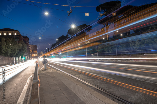Cool long exposure busy traffic neon blue-orange light trails, night view on the street road, Rome, Italy
