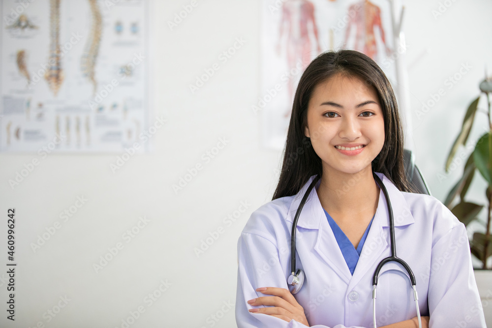 Young woman doctor smiling and working at office Young woman doctor smiling and working at office