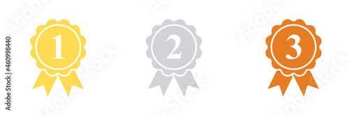 Rosettes of gold, silver and bronze dog ribbon awards for 1st, 2nd, and 3rd place winners.