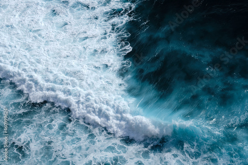 Fototapeta Naklejka Na Ścianę i Meble -  Aerial view to seething waves with foam. Waves of the sea meet each other during high tide and low tide