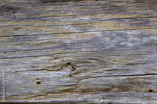 Gray, damaged board with a visible texture