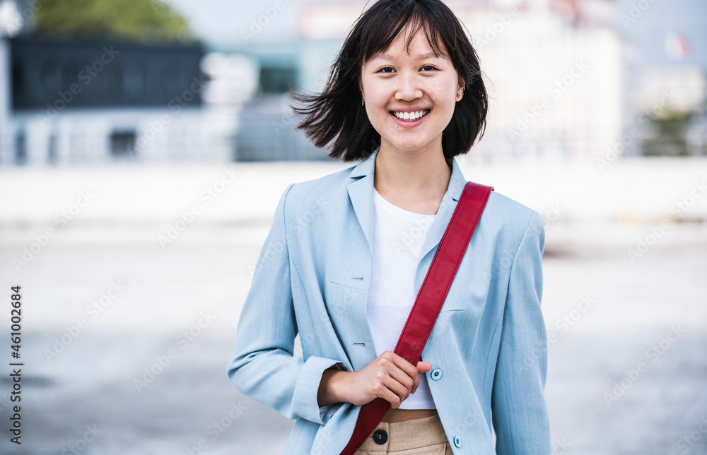 Smiling teenage girl with crossbody bag Stock Photo Adobe Stock