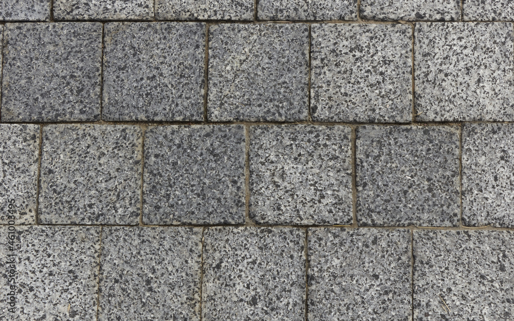 Gray granite pavement. Pavement texture background. Gray granite pavement. Pavement texture background.
