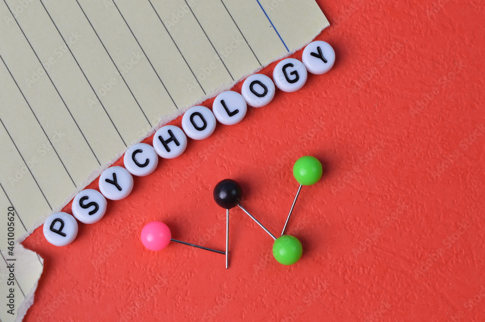 Alphabet beads with text PSYCHOLOGY isolated on a red background Alphabet beads with text PSYCHOLOGY isolated on a red background