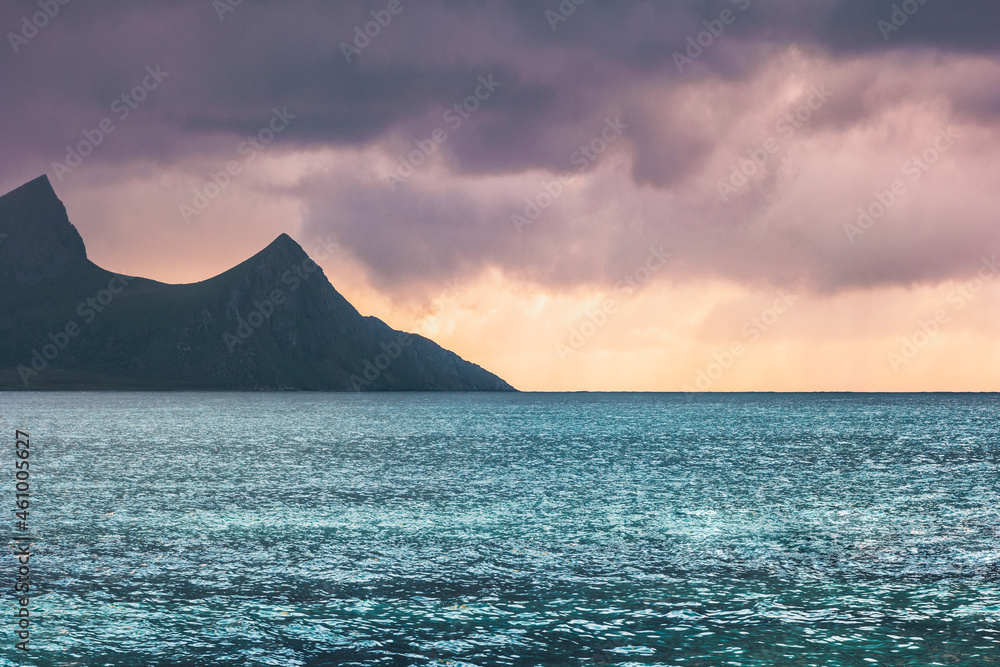 Sunset landscape in Norway Lofoten islands nature sea and mountain beautiful travel destinations stormy clouds weather Haukland beach Sunset landscape in Norway Lofoten islands nature sea and mountain beautiful travel destinations stormy clouds weather Haukland beach
