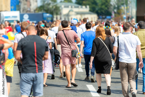 Crowd of people with men and women on busy city street