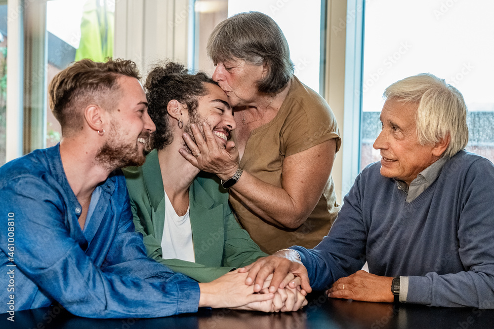 Obraz premium parents who welcome their son and his new gay boyfriend, concept of coming out from the closet and social inclusion, tolerant new society and modern family