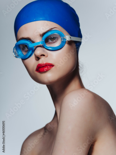 woman athlete in a swimming cap isolated background