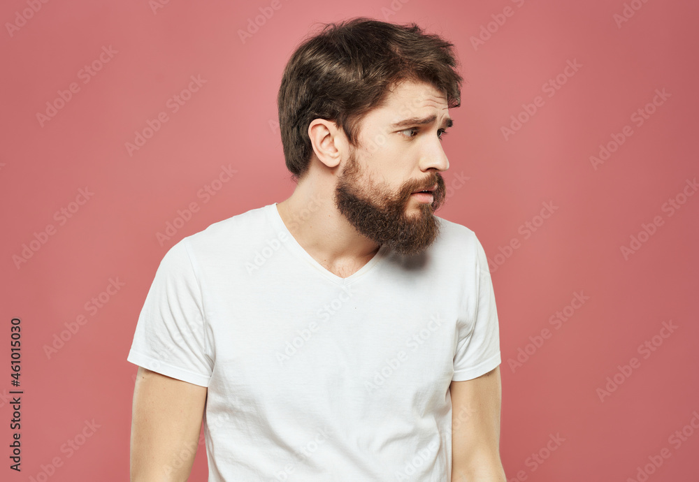 Man in a white t-shirt hand gestures anger close-up Man in a white t-shirt hand gestures anger close-up