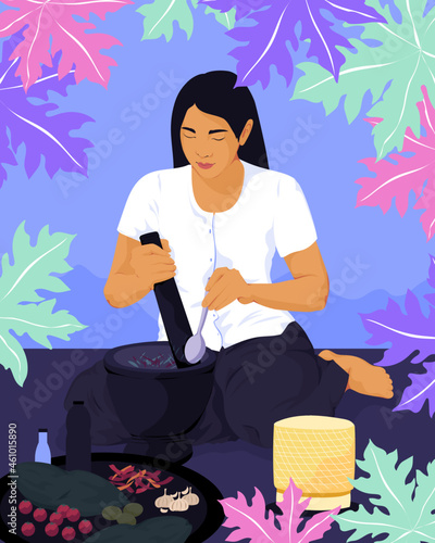 Asian woman cooking homemade meal with pestle and mortar 