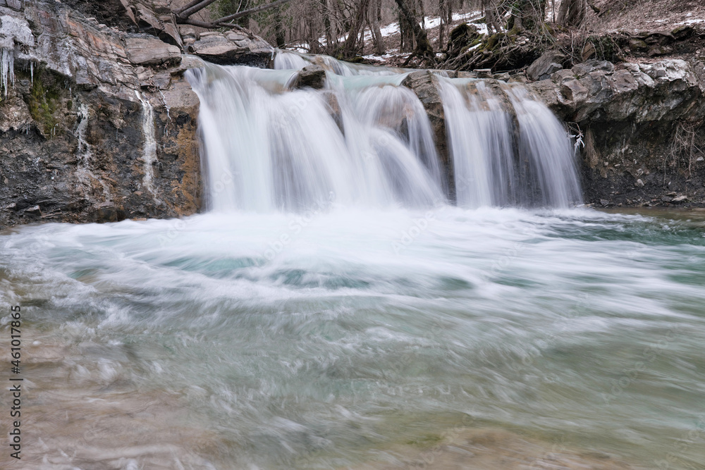 View of waterfall on Zhane river on cloudy winter day. Krasnodar Krai, Caucasus, Russia. View of waterfall on Zhane river on cloudy winter day. Krasnodar Krai, Caucasus, Russia.