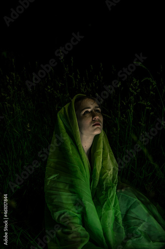 Saint Mary cosplay in green draping outdoors