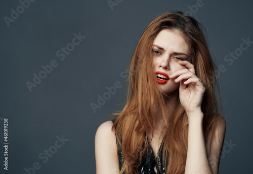 pretty woman Red hair charm posing cosmetics dark background