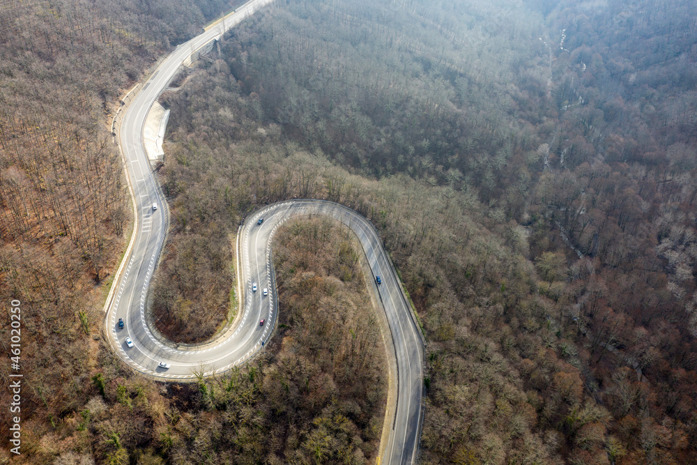 Aerial view of mountain road between Vozrozhdenie and Mikhaylovsky Pereval villages on winter day. Krasnodar Krai, Russia. Aerial view of mountain road between Vozrozhdenie and Mikhaylovsky Pereval villages on winter day. Krasnodar Krai, Russia.