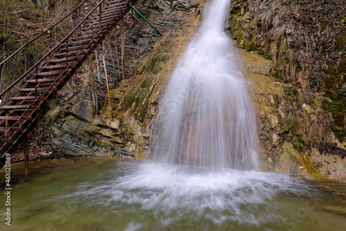 View of Lace (Shnurok) waterfall in Teshebs river gorge on winter day. Gebiusskie waterfalls, Krasnodar Krai, Caucasus, Russia. photo