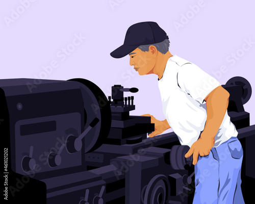 Man working with industrial metal lathe machine