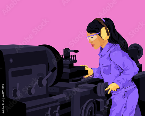 Woman operating heavy industrial machinery in factory