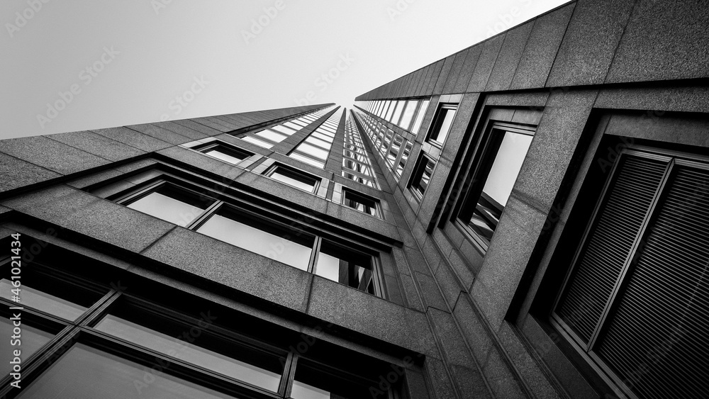 Obraz premium abstract view of Modern building in the city. Perspective Look up view with sunlight. Architecture, construction, investment, finance. Urban geometry