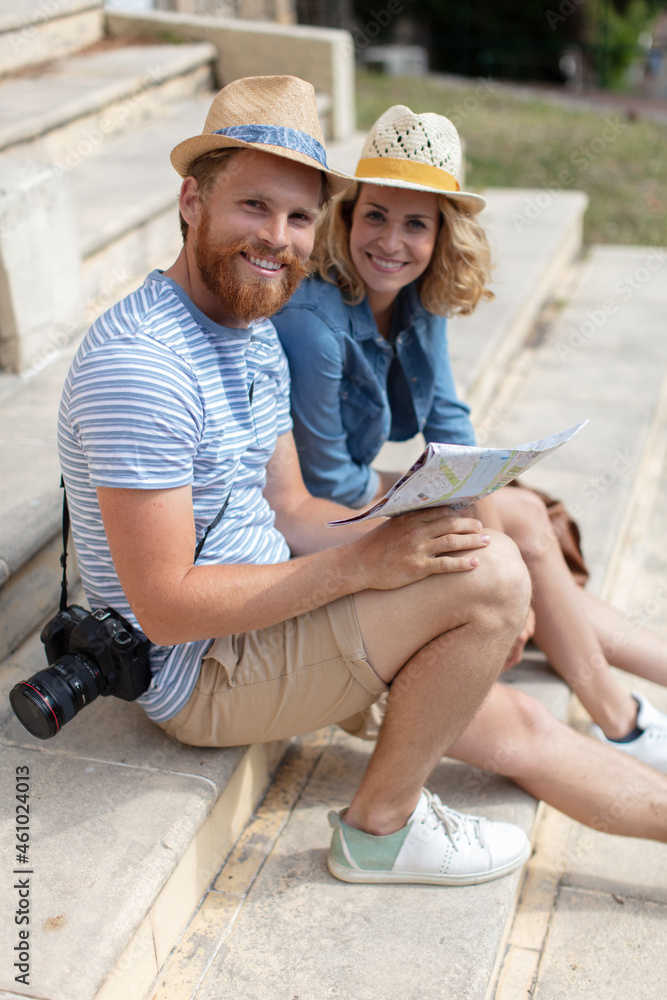 portrait of a smiling happy young couple at the seaside