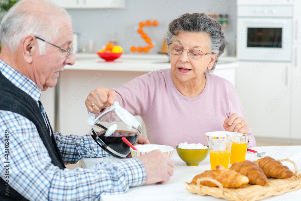 a senior couple having breakfast a senior couple having breakfast