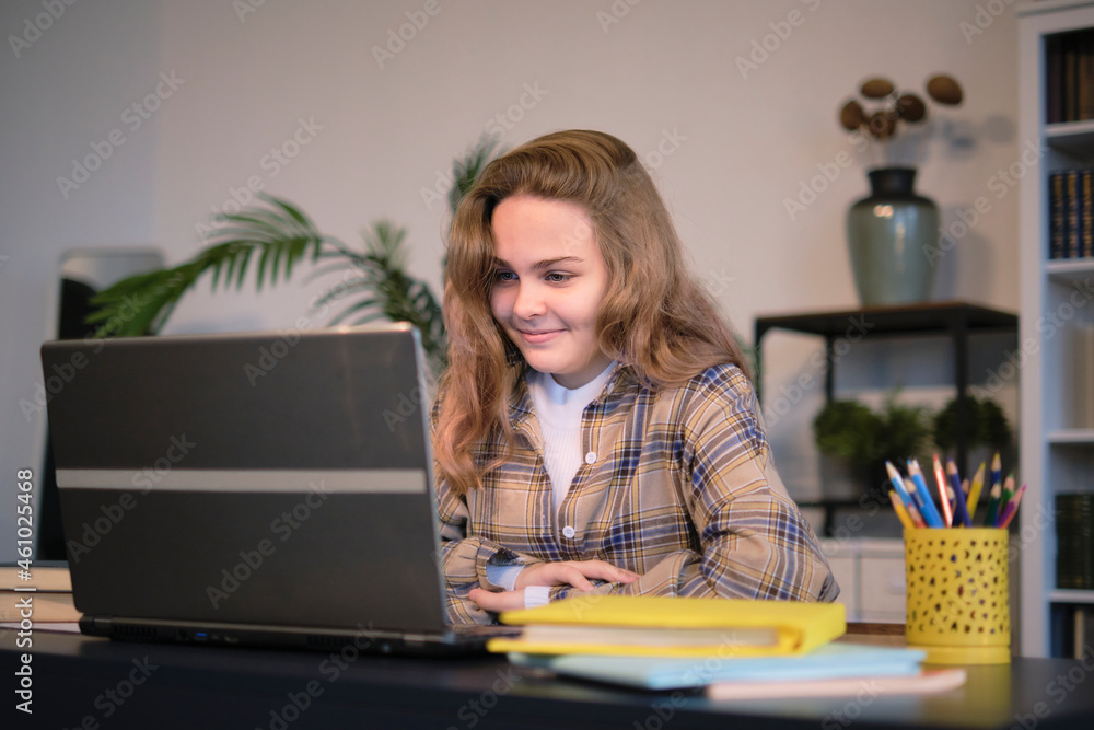 Teenage girl doing homework at a desk in her bedroom. teen girl school ...