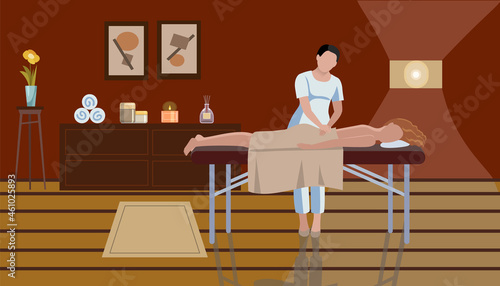 Woman masseur is making massage to woman in the  spa salon