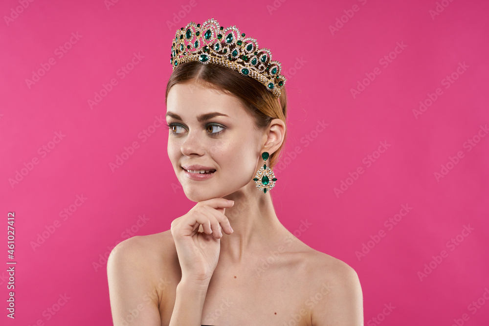 attractive woman with a crown on her head makeup decoration pink background attractive woman with a crown on her head makeup decoration pink background
