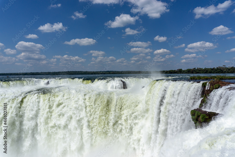Iguazu Falls, located on the border of Argentina and Brazil, is the largest waterfall in the world. Iguazu Falls, located on the border of Argentina and Brazil, is the largest waterfall in the world.