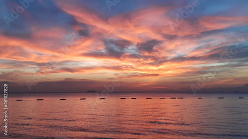 Calm sea with colorful sunset sky and clouds. Meditation ocean background. 