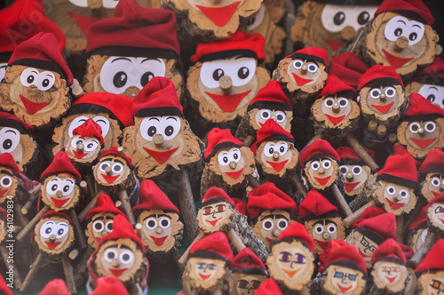 Tió de Nadal. A hollow log with a barretina, called Tió, is a Catalan Christmas tradition. The children feed him and on Christmas Day he shits them presents.