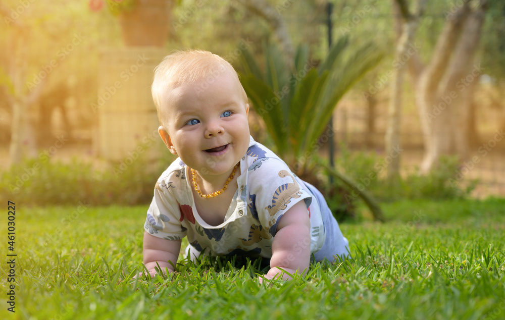 Smiling baby boy playing outdoors Smiling baby boy playing outdoors