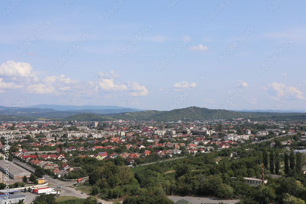 view of the city. Scenic view of the town in the mountains on a cloudy summer day.