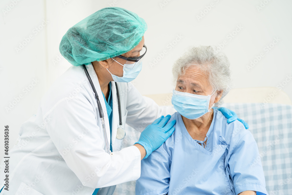 Doctor help Asian senior or elderly old lady woman patient wearing a face mask in hospital for protect safety infection and kill Covid-19 Coronavirus. Doctor help Asian senior or elderly old lady woman patient wearing a face mask in hospital for protect safety infection and kill Covid-19 Coronavirus.