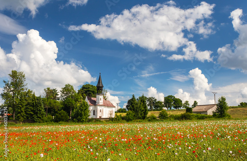 summer rural landscape with poppy field and church, Chapel of St. Anthony at Vojnuv Mestec, Czech republic
