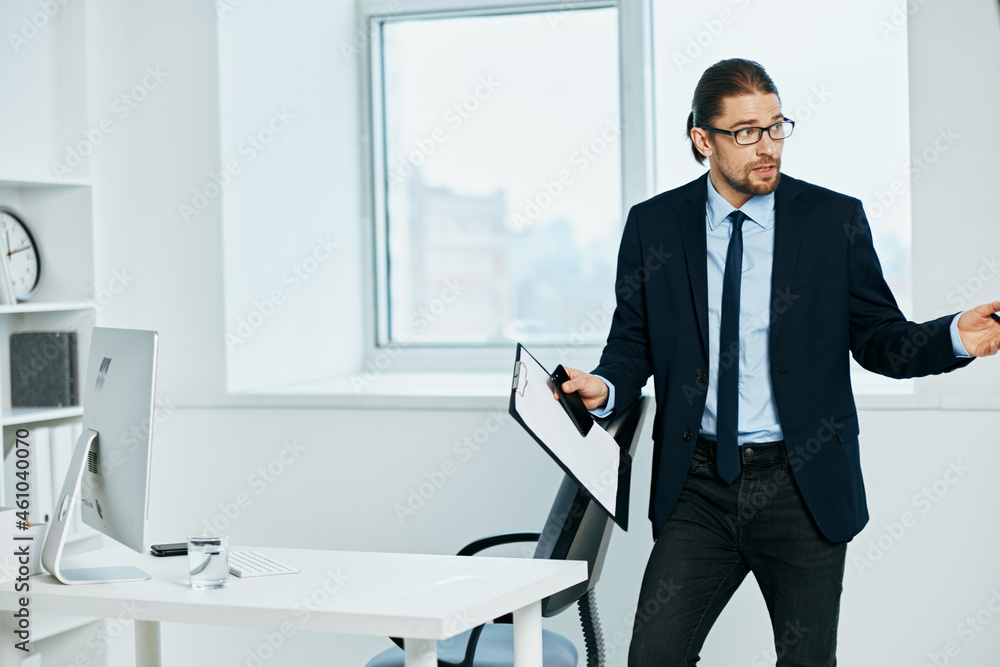 male manager in the office gestures with his hands Lifestyle male manager in the office gestures with his hands Lifestyle