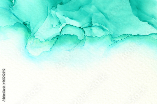 art photography of abstract fluid alcohol ink painting, blue and turquoise colors with paper texture