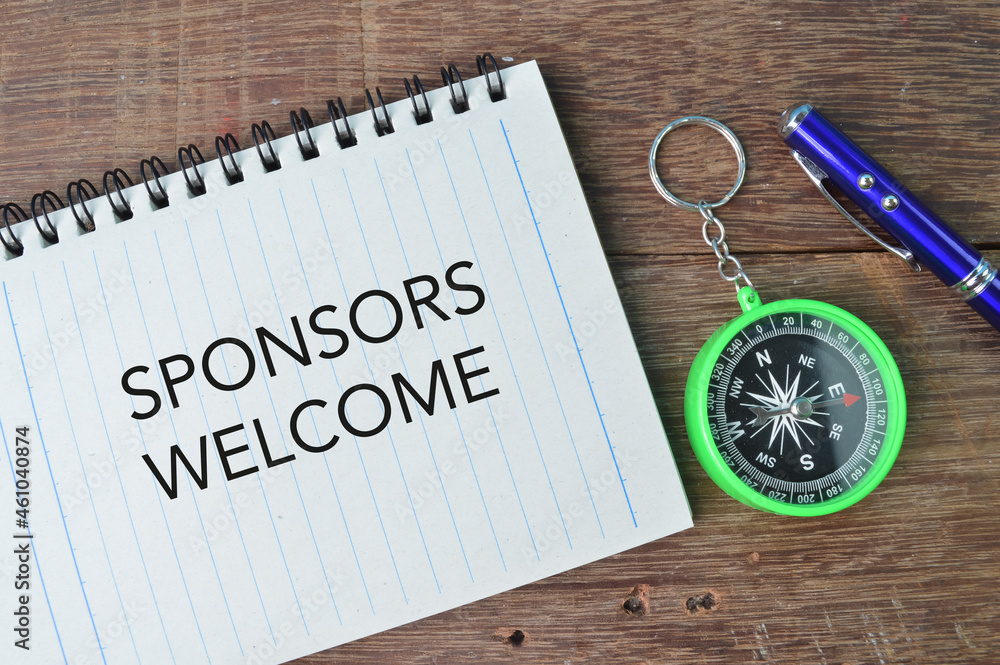 Pen, compass and notebook written with text SPONSORS WELCOME Pen, compass and notebook written with text SPONSORS WELCOME